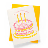 Birthday card with a cake illustration and candles on a yellow envelope