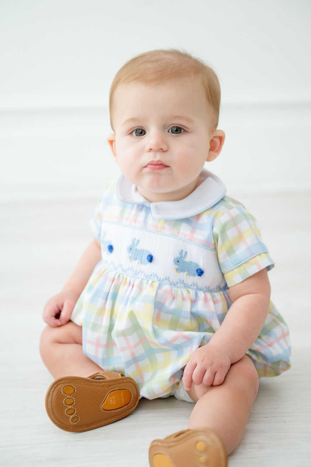 The Smocked Easter Bunnies Bubble is available in sizes NB to 3T, making it ideal for your little one.