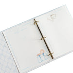 Open notebook with a ring binder on a white background