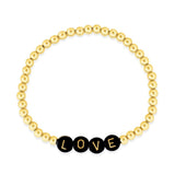 Name bracelet stacked with simple gold beaded bracelets on left model's wrist and heart bracelet with gold beads on right model's wrist