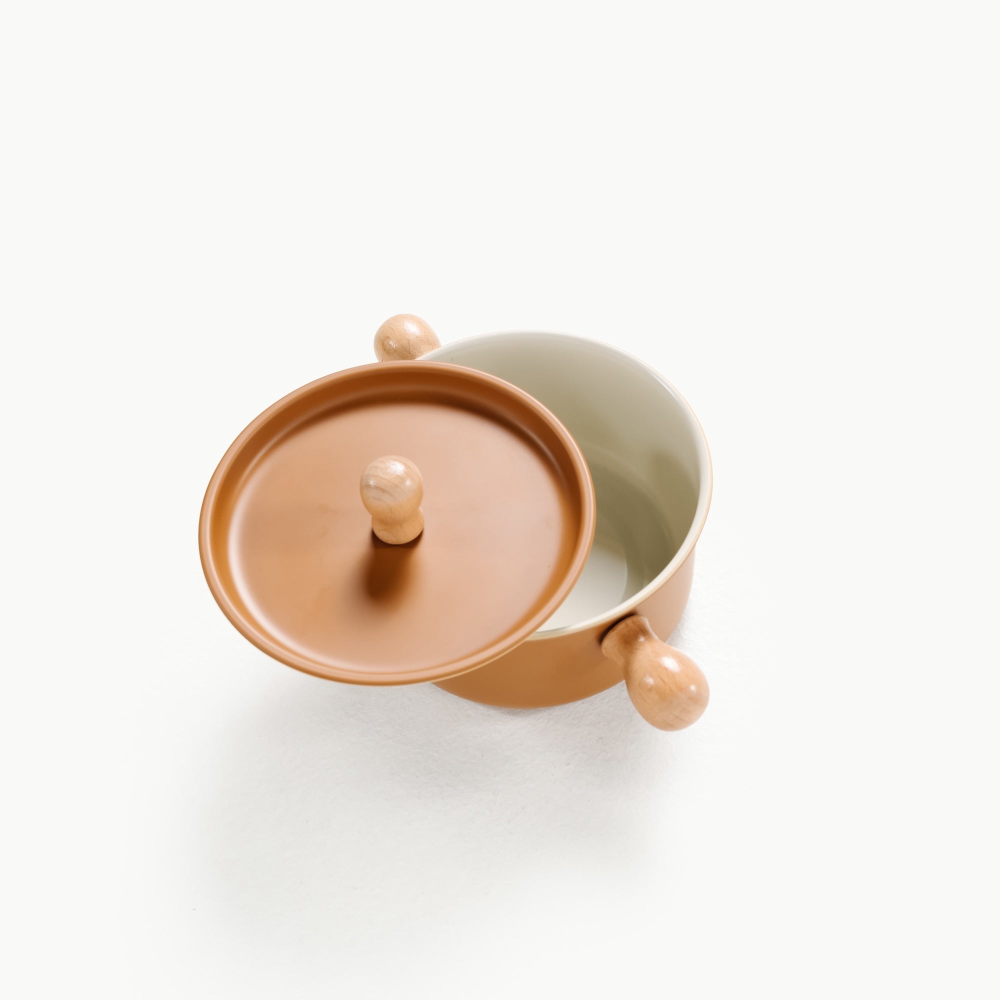 Two ceramic containers with lids on a white background