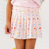 Skirt with colorful pattern worn by a person on a white background