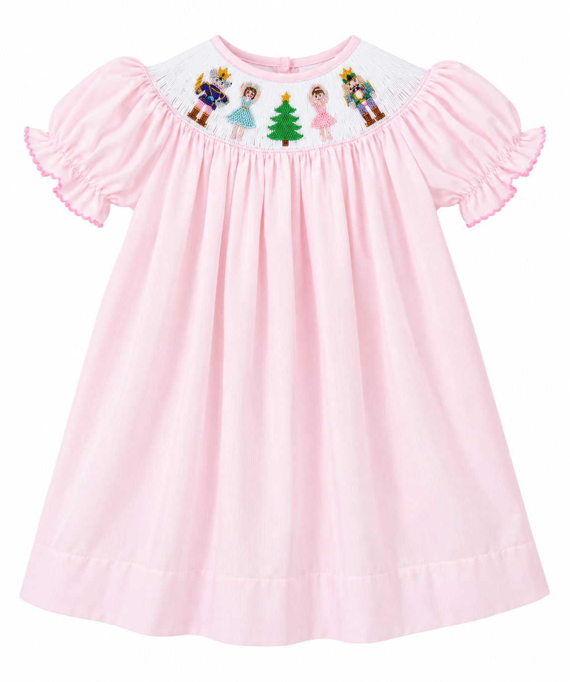 A light pink baby dress with short ruffled sleeves and a white smocked yoke featuring embroidered cartoon characters and a green Christmas tree.