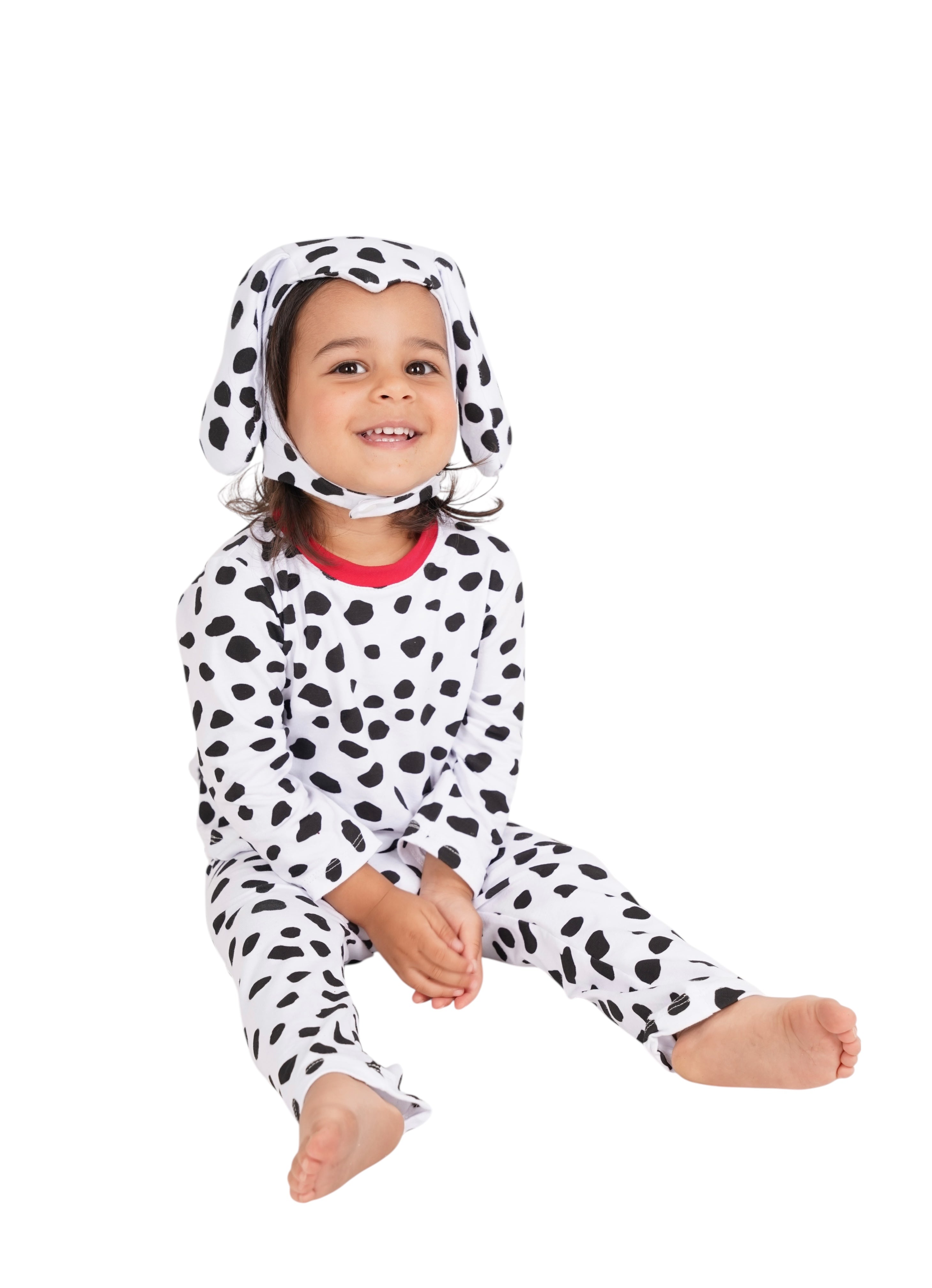 Child wearing a Dalmatian costume on a white background