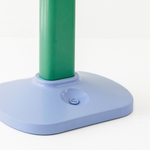 Green pole with a blue base on a white background