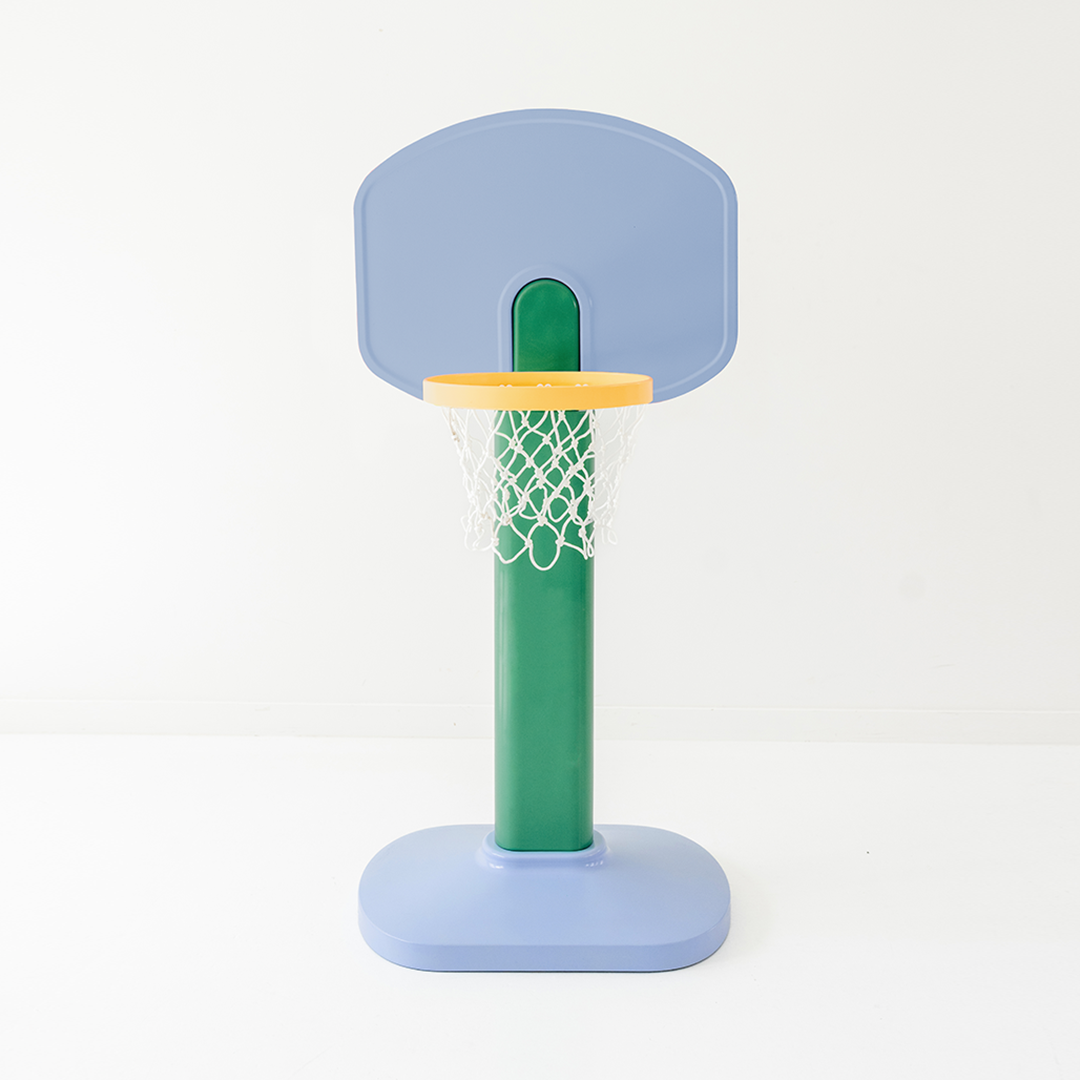 Children's basketball hoop with a blue backboard and green pole on a white background