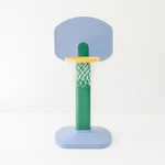 Children's basketball hoop with a blue backboard and green pole on a white background