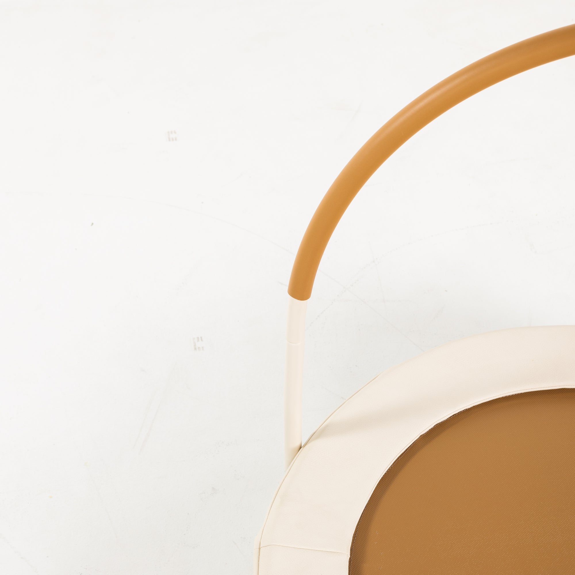 Close-up of a product with a handle and beige color on a white background