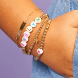 LeMel Kid's Custom Everyday Stretch Bracelet- White Bead With Rainbow Letters