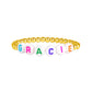 LeMel Kid's Custom Everyday Stretch Bracelet- White Bead With Rainbow Letters