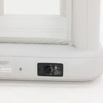Close-up of a white inflatable mattress with a control panel on a white background
