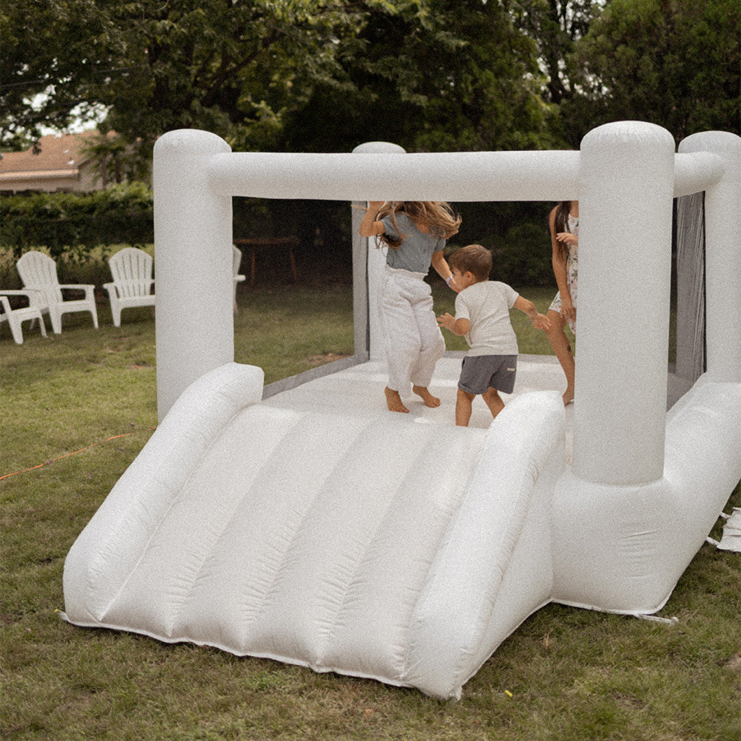 Inflatable play structure with children playing outdoors
