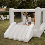 Inflatable play structure with children playing outdoors