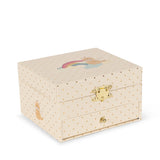 A cream-colored wooden jewelry box with a gold-tone clasp and a small rainbow illustration on the lid, set against a plain white background.
