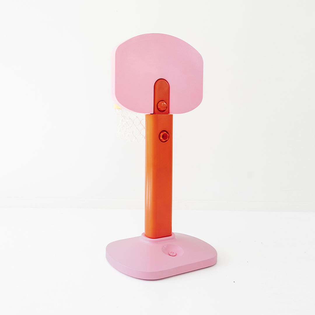 Pink and orange basketball hoop on a white background