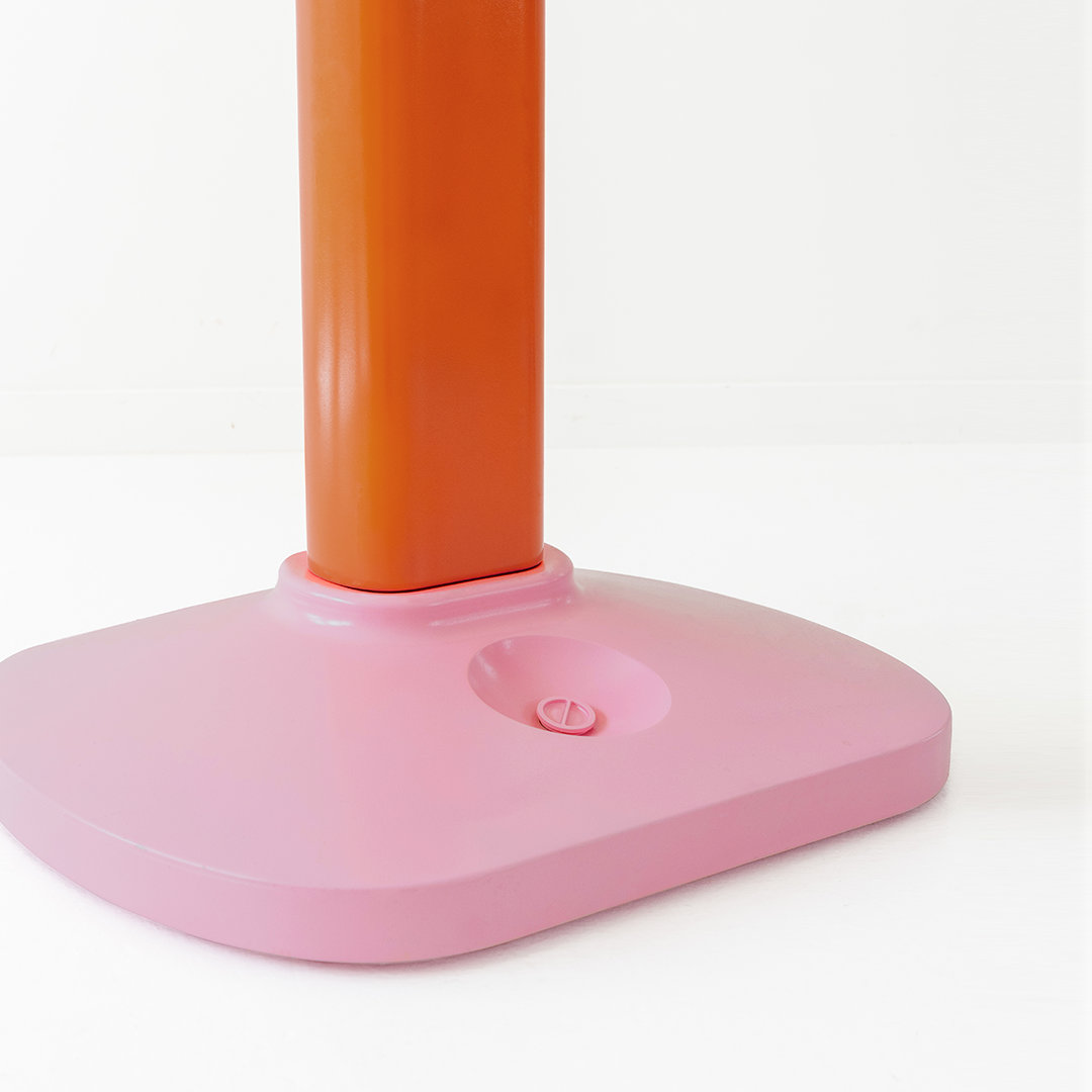 Pink base with an orange pole on a white background