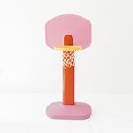 Pink and orange children's basketball hoop on a white background