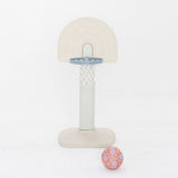 Children's basketball hoop with floral-patterned ball on a white background