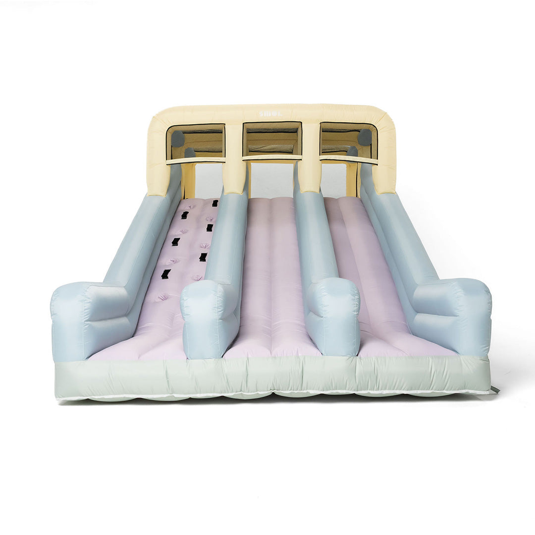 Inflatable slide with pink and blue gradient on a white background