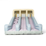 Inflatable slide with pink and blue gradient on a white background